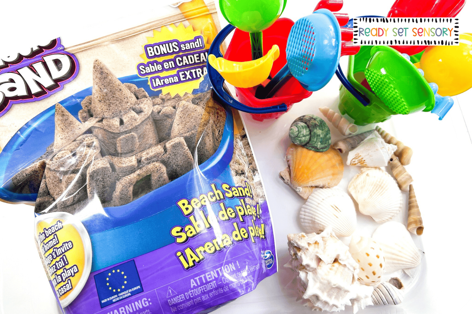 Beach sensory bin supplies including popcorn kernels and snacks
