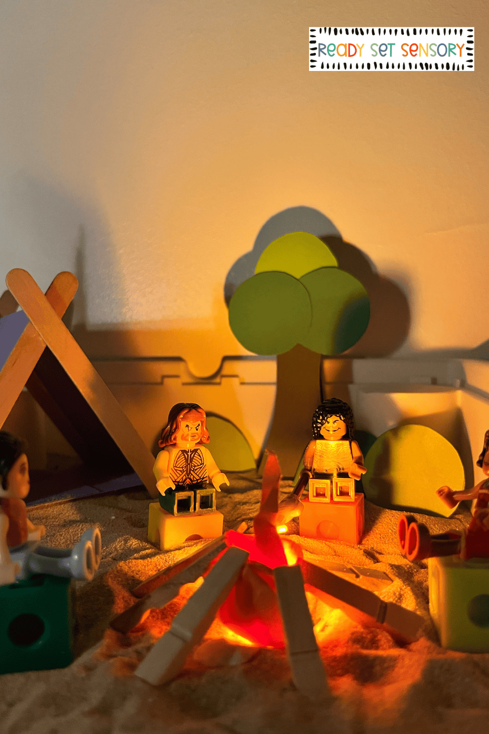 Pretend campfire scene in camping sensory bin activity