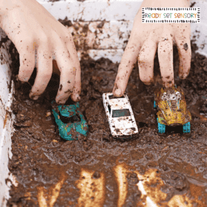 Toy cars in muddy water car wash sensory bin activity