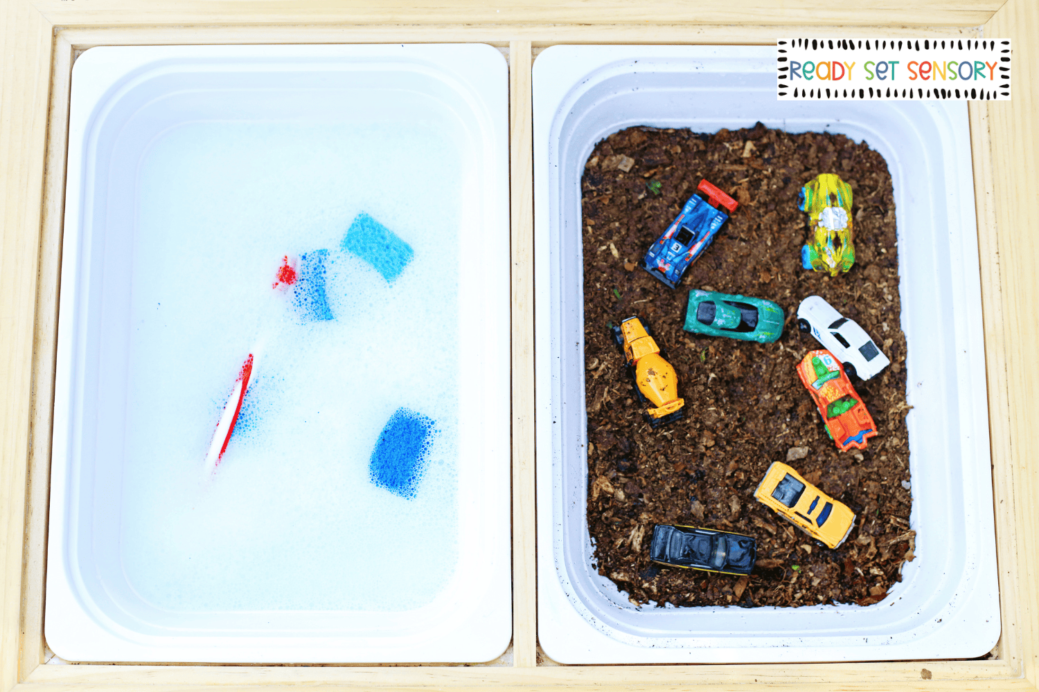 Car wash sensory bin setup with toy cars, water, and bins