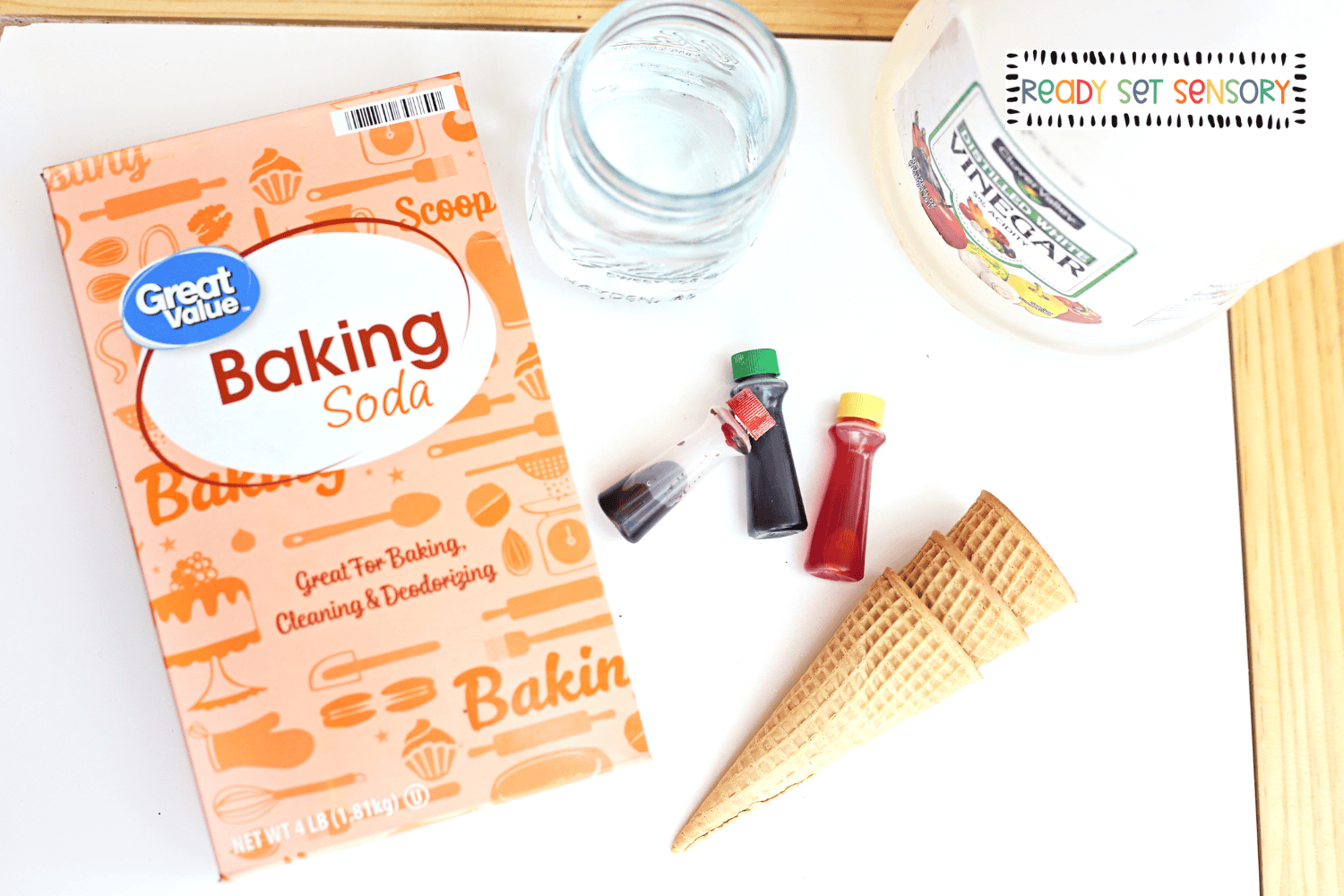 Fizzy volcano sensory bin supplies with baking soda