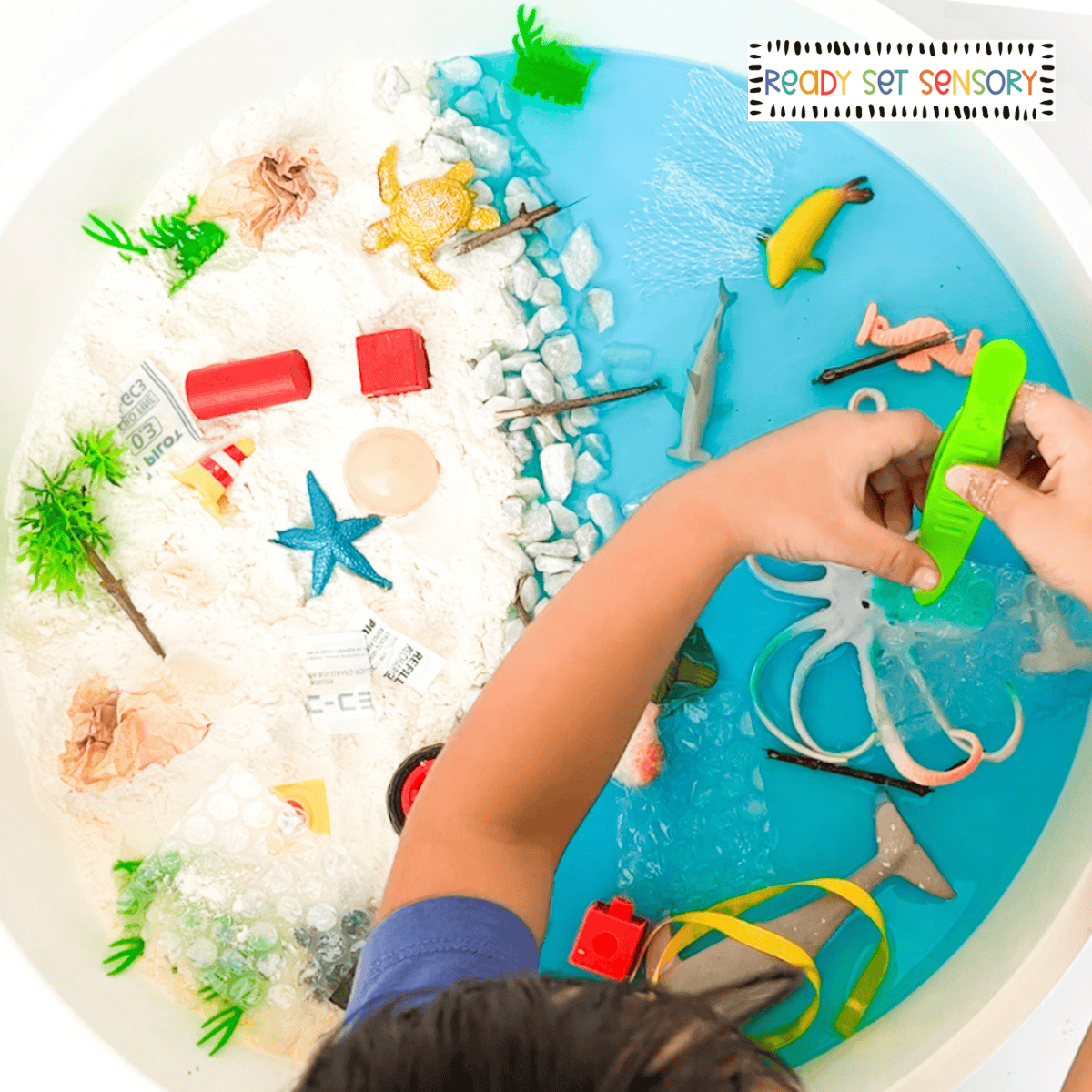 Ocean rescue sensory bin with sea animals, water play, and fine motor tools