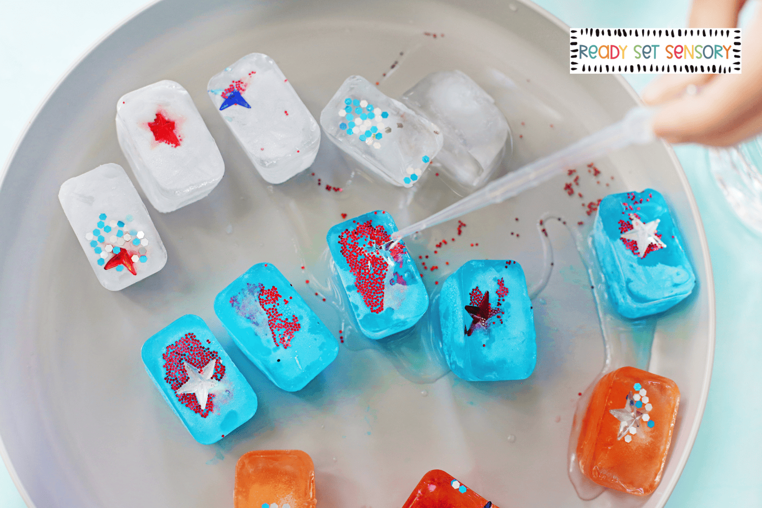 Melting patriotic ice cubes with stars and glitter