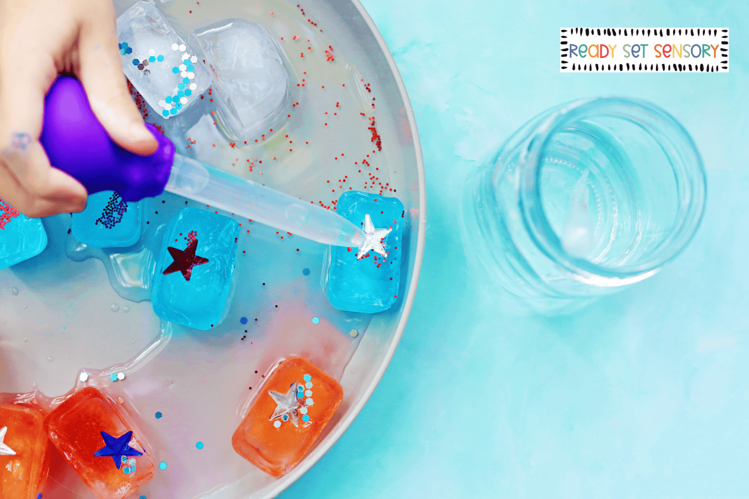Child using dropper on patriotic ice cube activity