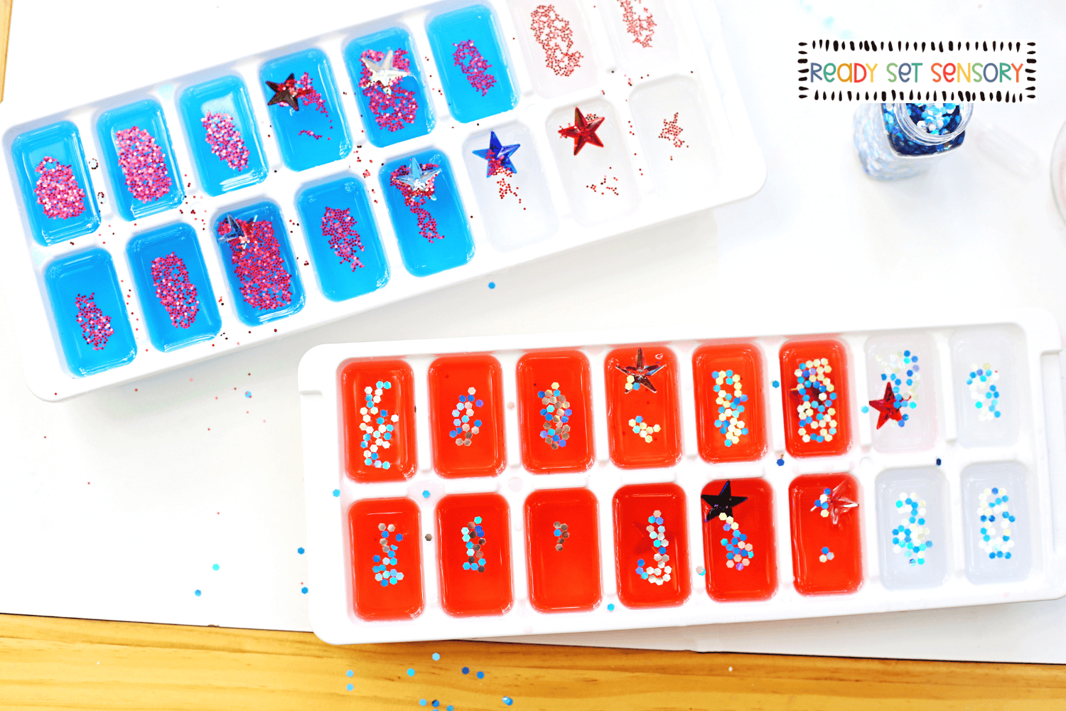 Red, white, and blue patriotic ice cubes with stars and sprinkles