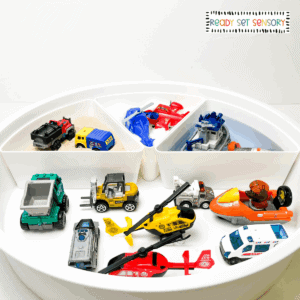 Vehicles sorting sensory bin for toddlers with land, air, and water toys