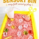 Child building fine motor skills with a Fall Apple Juice Sensory Bin (Easy & Cheap!)