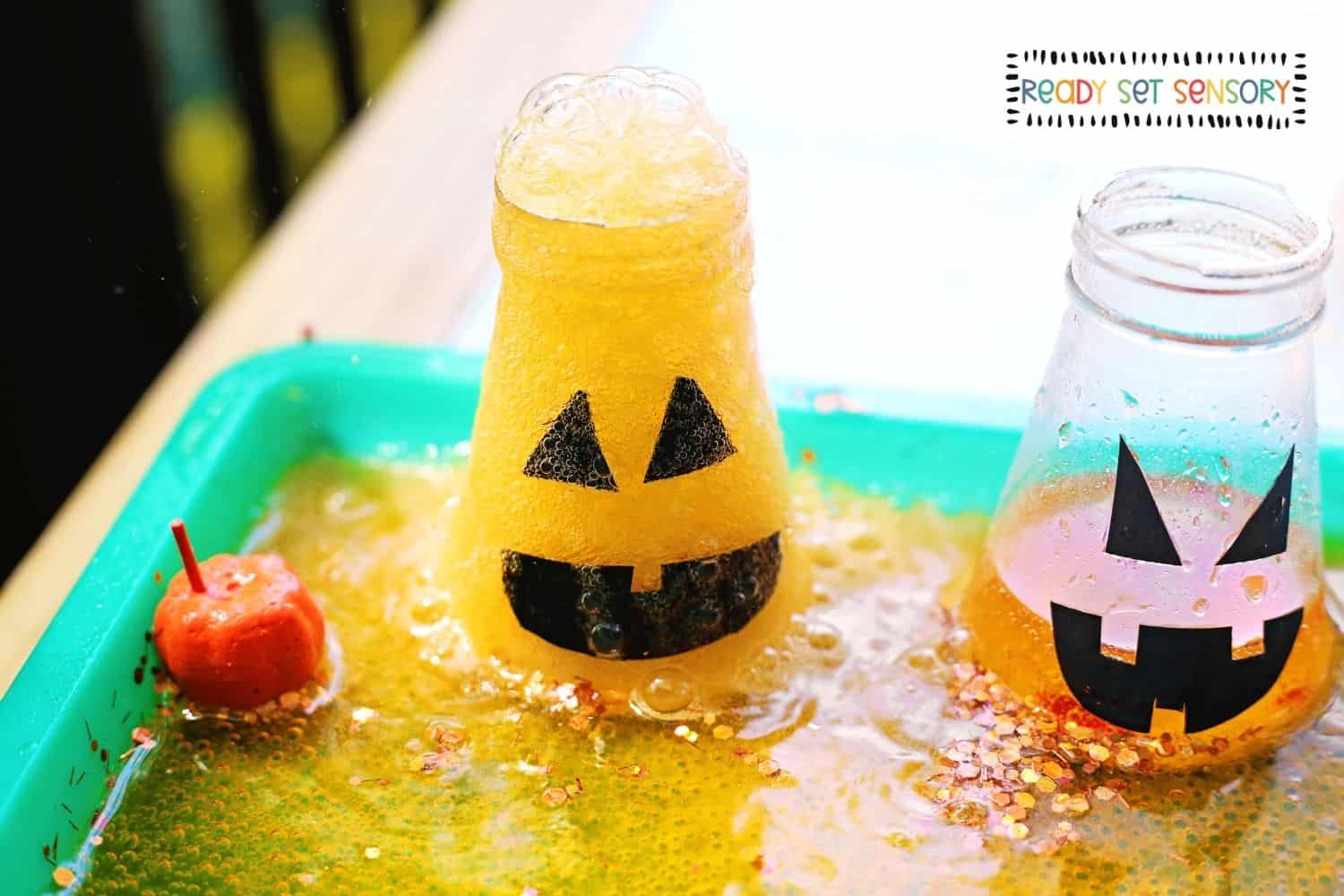 Toddler playing with a Fizzy Jack-o-Lantern Potions